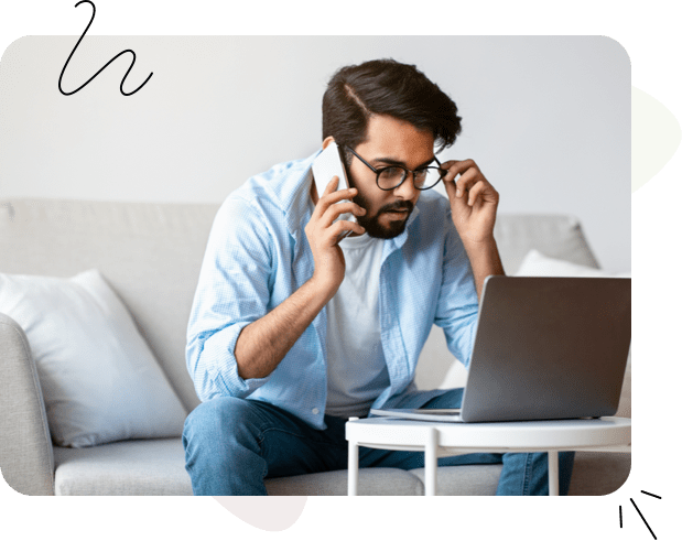 A man on the phone with support looking at his website